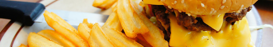 Eating Burger at Arry's Super Burgers restaurant in Montebello, CA.
